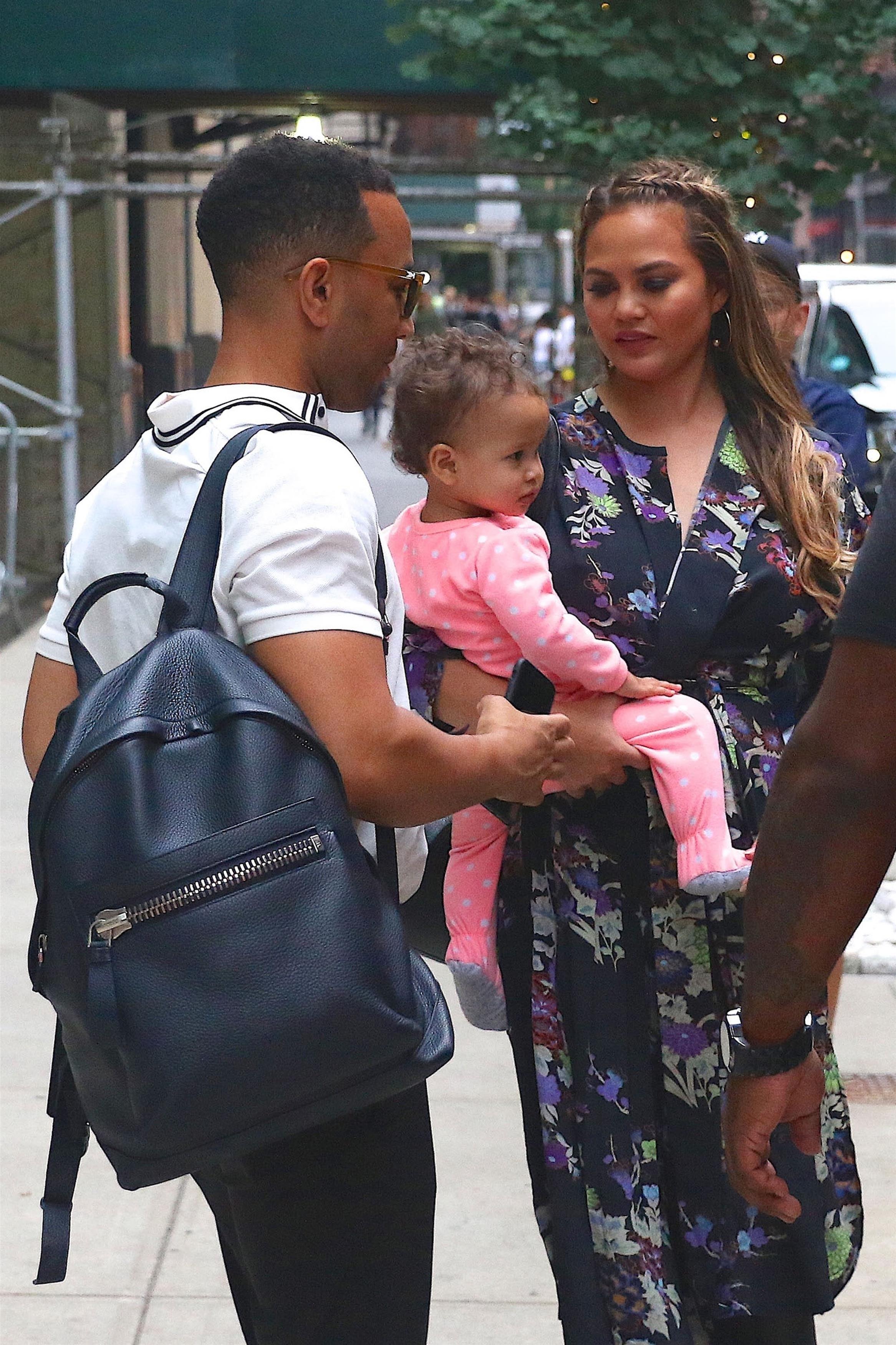 Chrissy Teigen &amp; John Legend check out of their hotel in New York