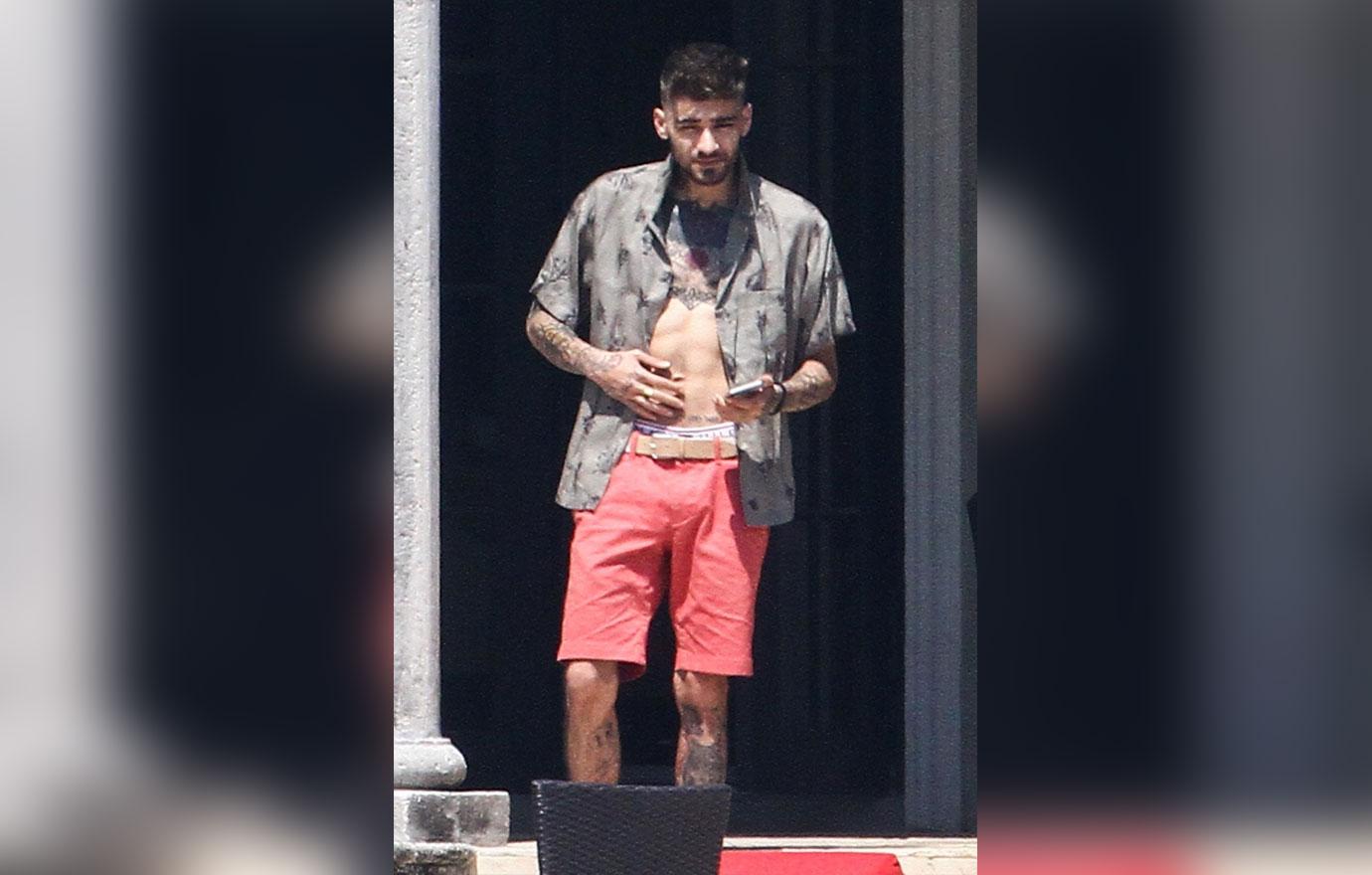 Zayn Malik looks extremely thin as he chain smokes by the pool after split from Gigi Hadid