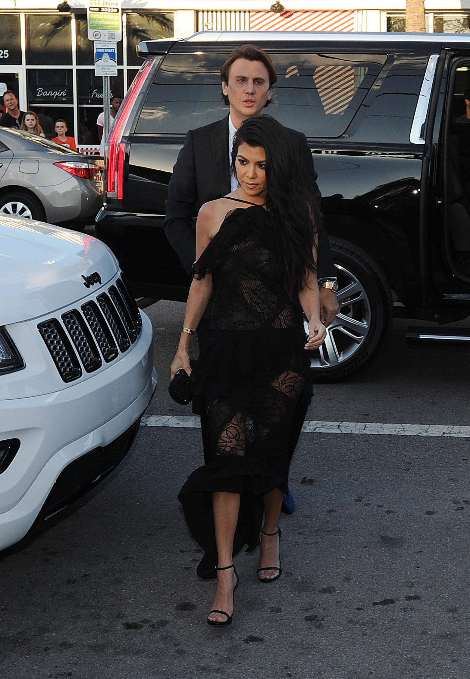 Kim Kardashian, Kanye West and Kourtney Kardashian arrive to friends wedding in Miami