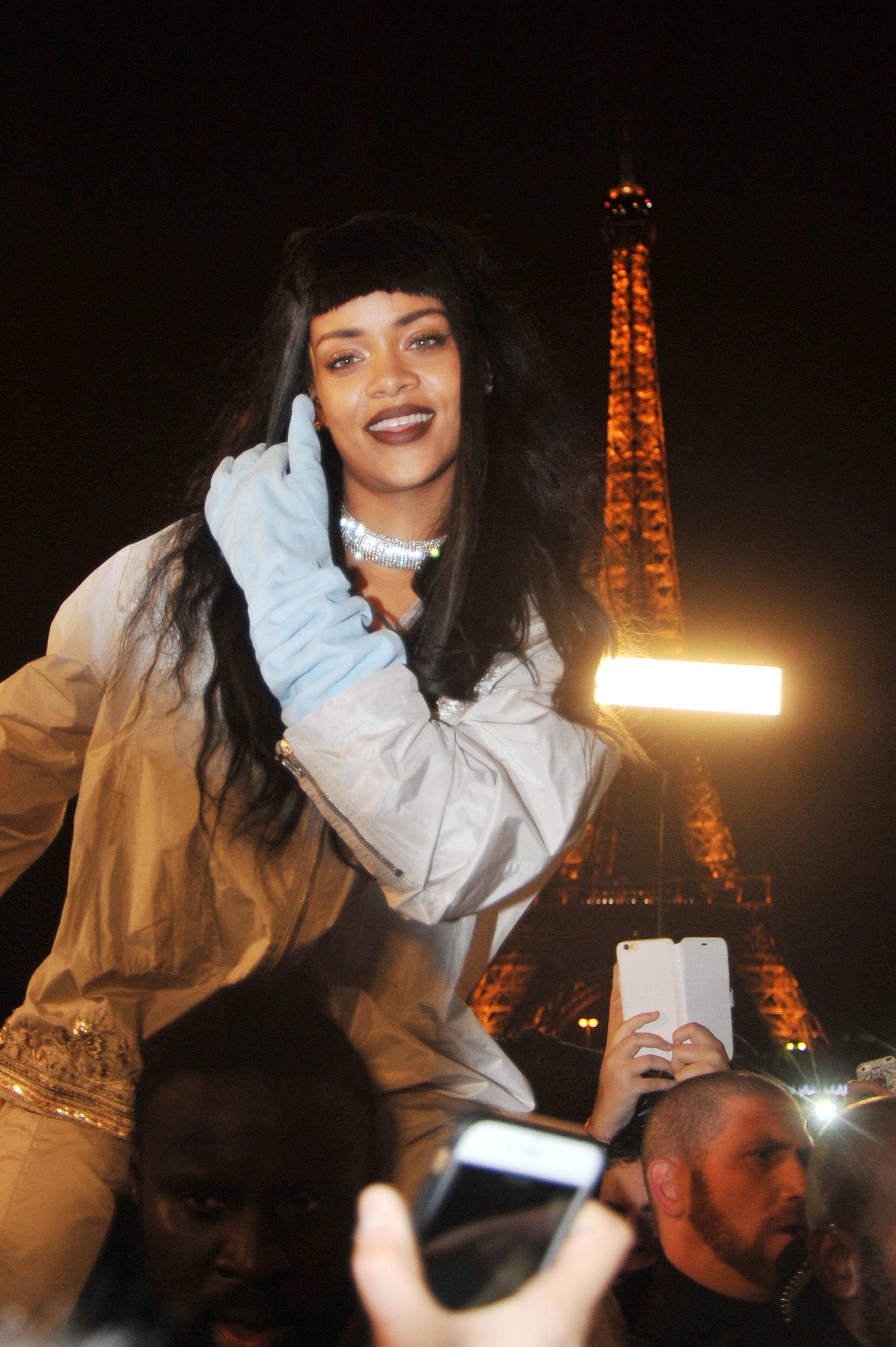 Rihanna shoots footage with her fans around the Eiffel Tower in Paris