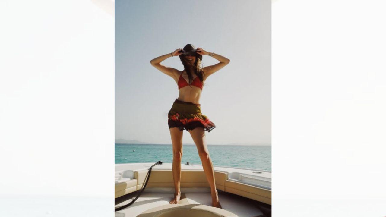 Image of Kelsea Ballerini celebrated her 33rd birthday in style, sporting a tiny red bikini on a luxury boat.