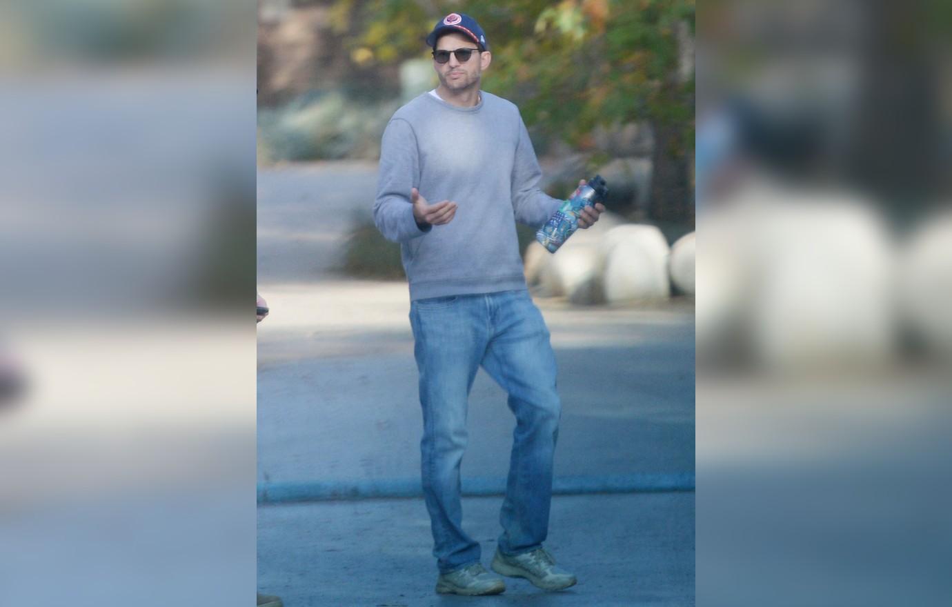 ashton kutcher looks downcast photo