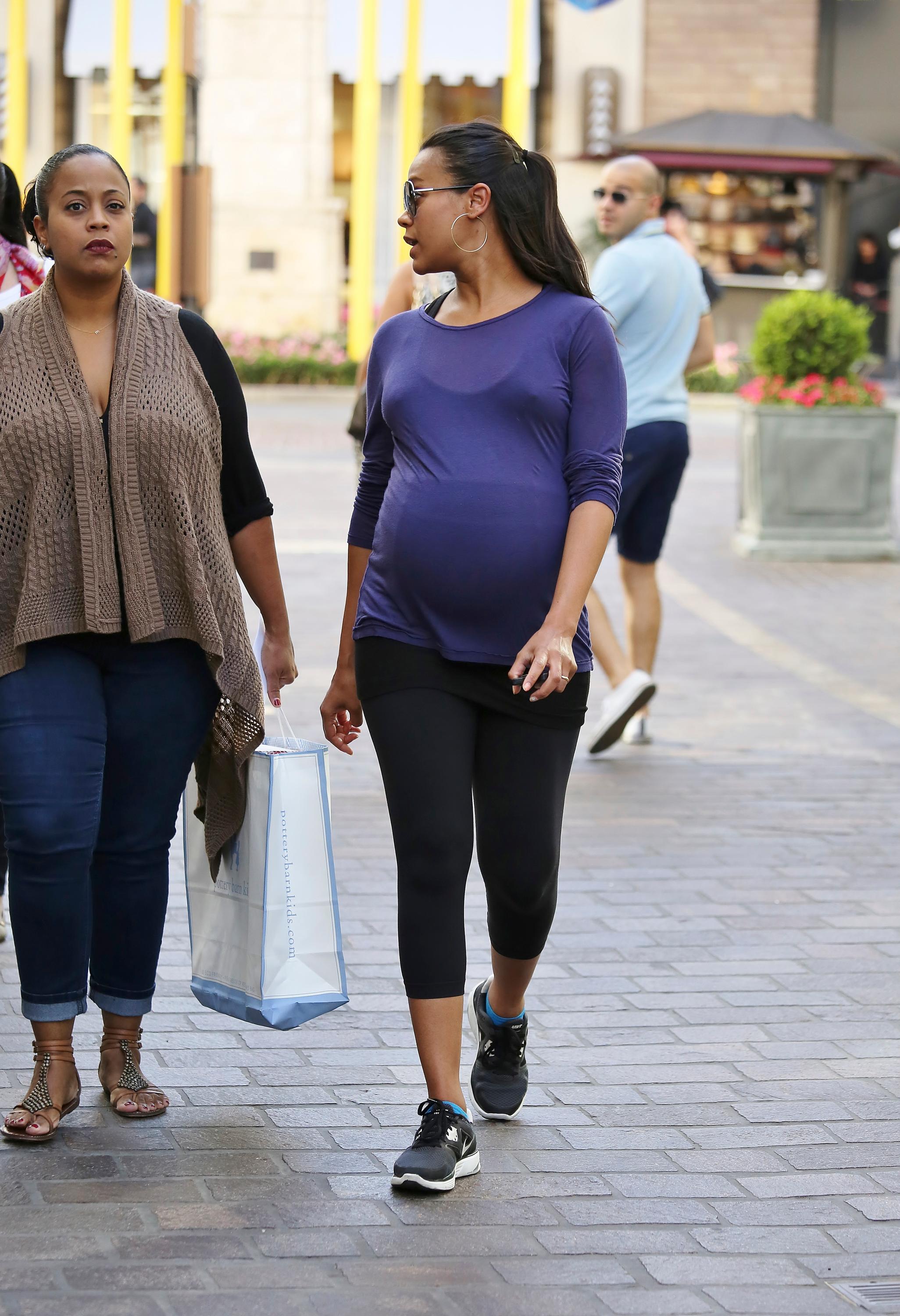 Pregnant Zoe Saldana shops at The Grove in West Hollywood, California