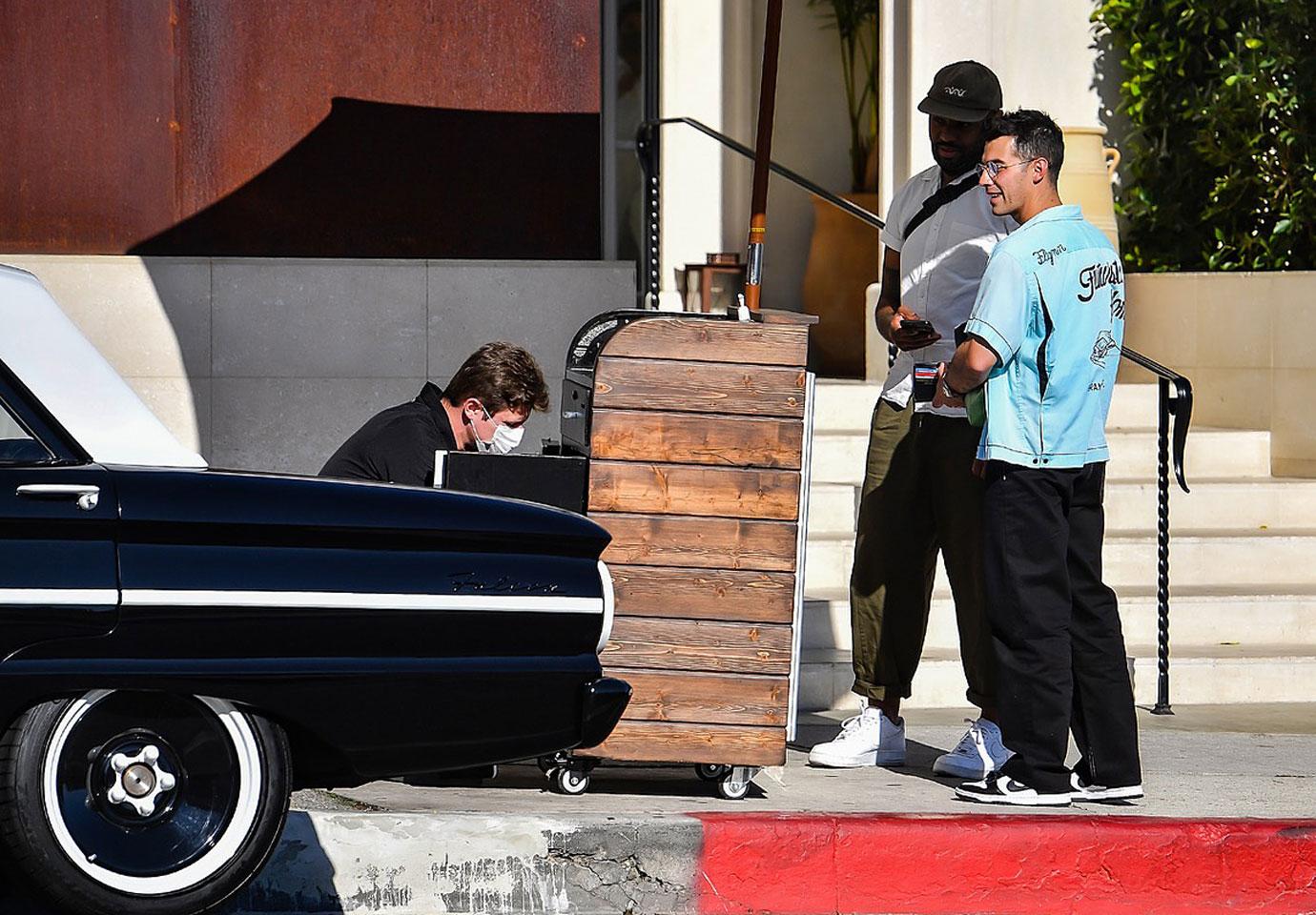 joe jonas drives away in his classic ford falcon