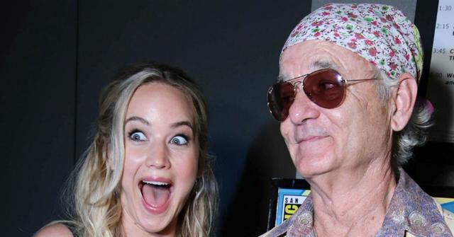Jennifer Lawrence, in a sleeveless dress, met Bill Murray, who sported a flowery bandana and tan jacket.