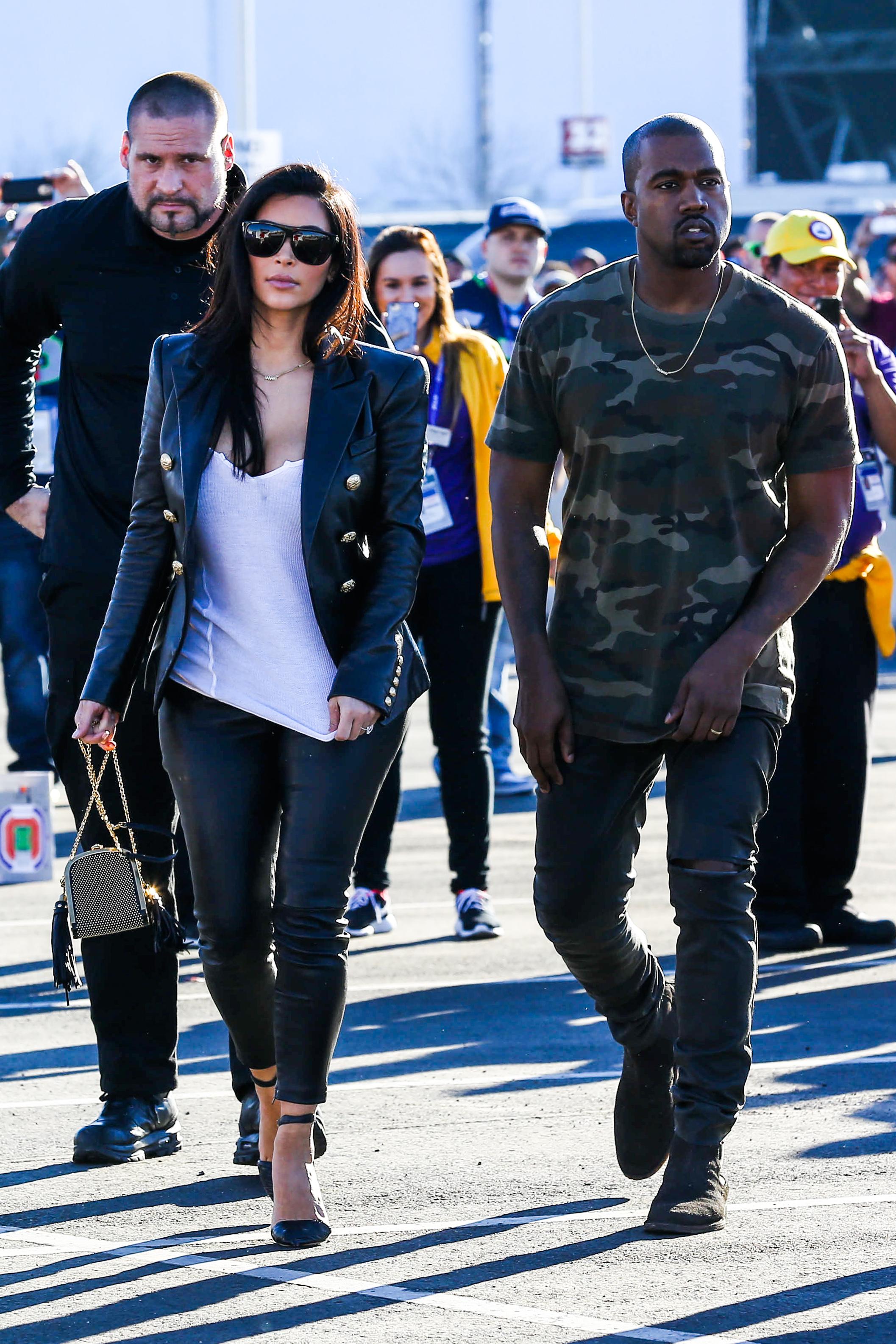 Kim Kardashian and Kanye West arrive for the Super Bowl XLIX