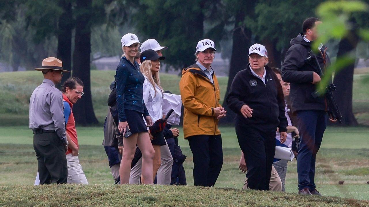 Image of The White House aide was spotted watching Donald Trump golf from a cart in New Jersey.