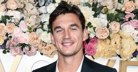 Tyler Cameron In Front Of A step And Repeat