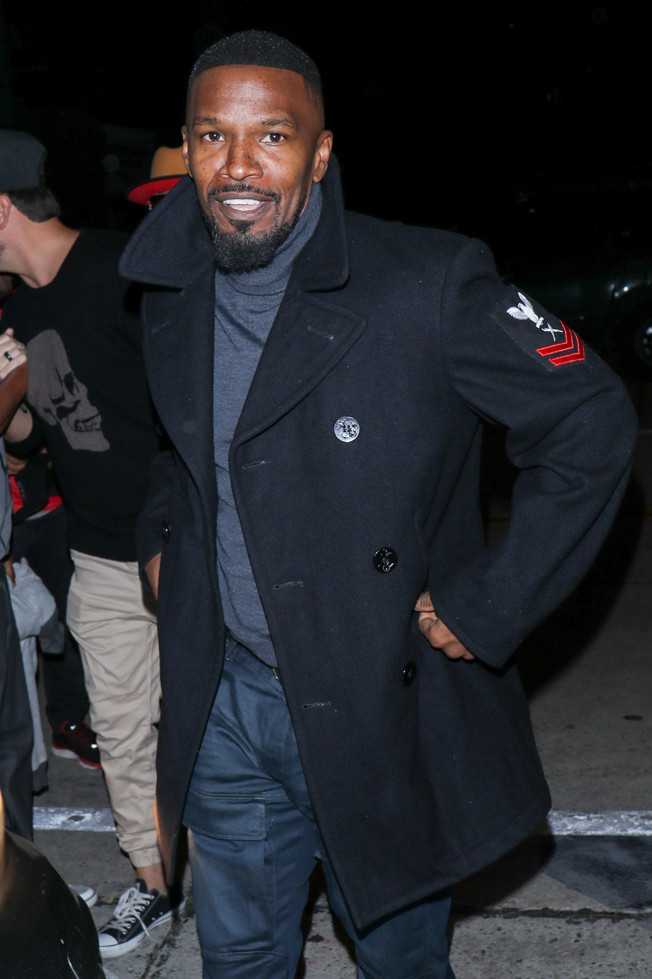 Jamie Foxx warms up outside of Catch