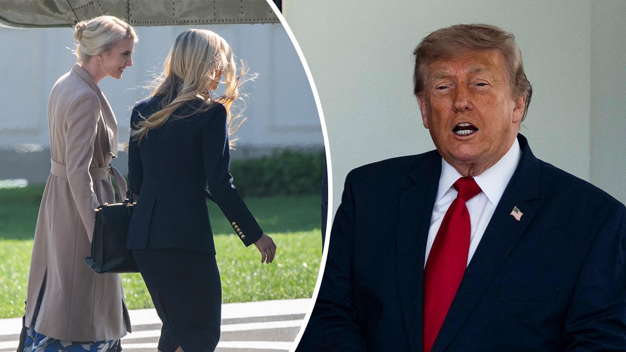 Image of A photo of Donald Trump being ogled by his two blonde aides has sparked mass commentary and speculation.