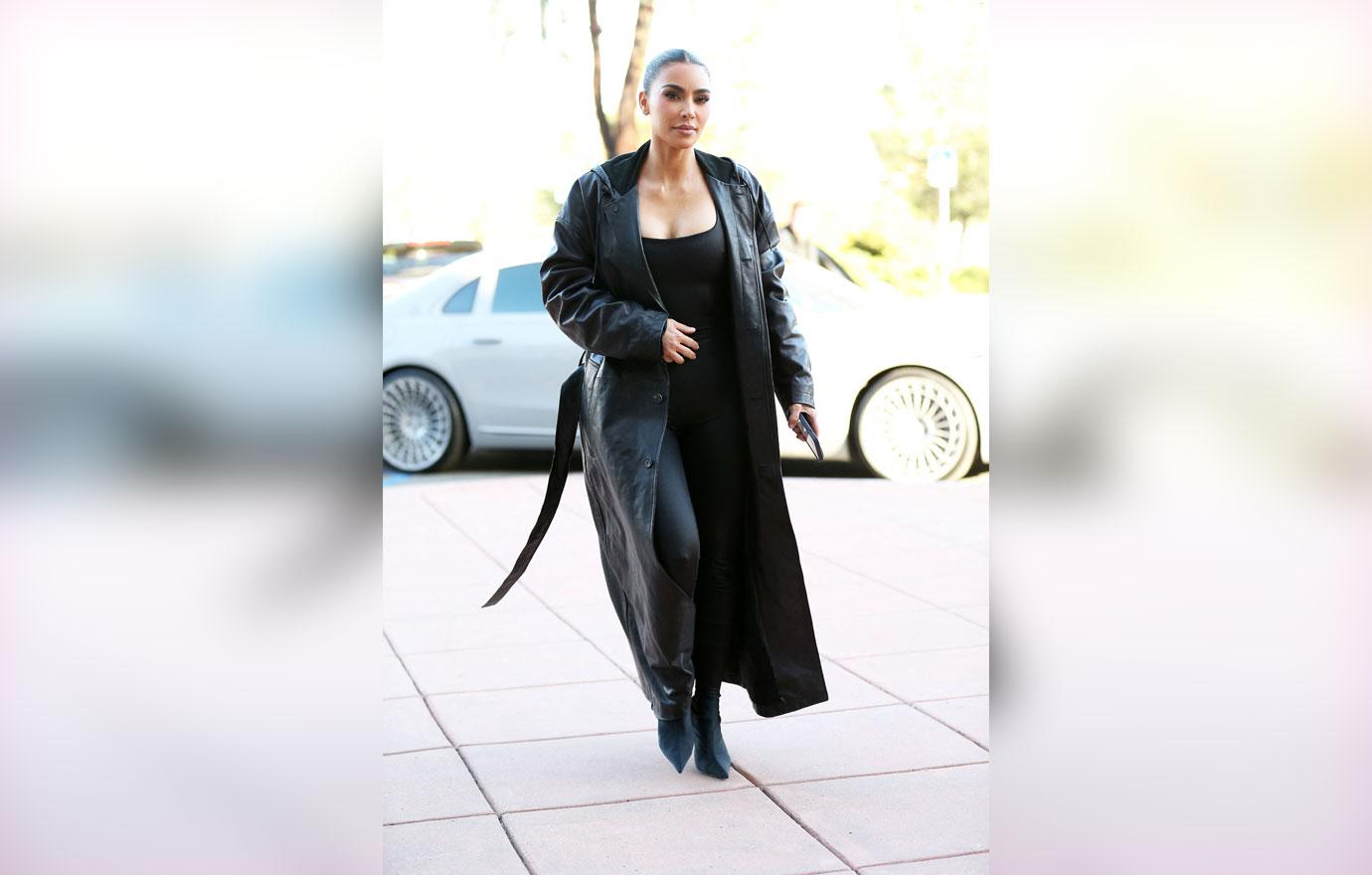 kim kardashian wears a long black leather jacket