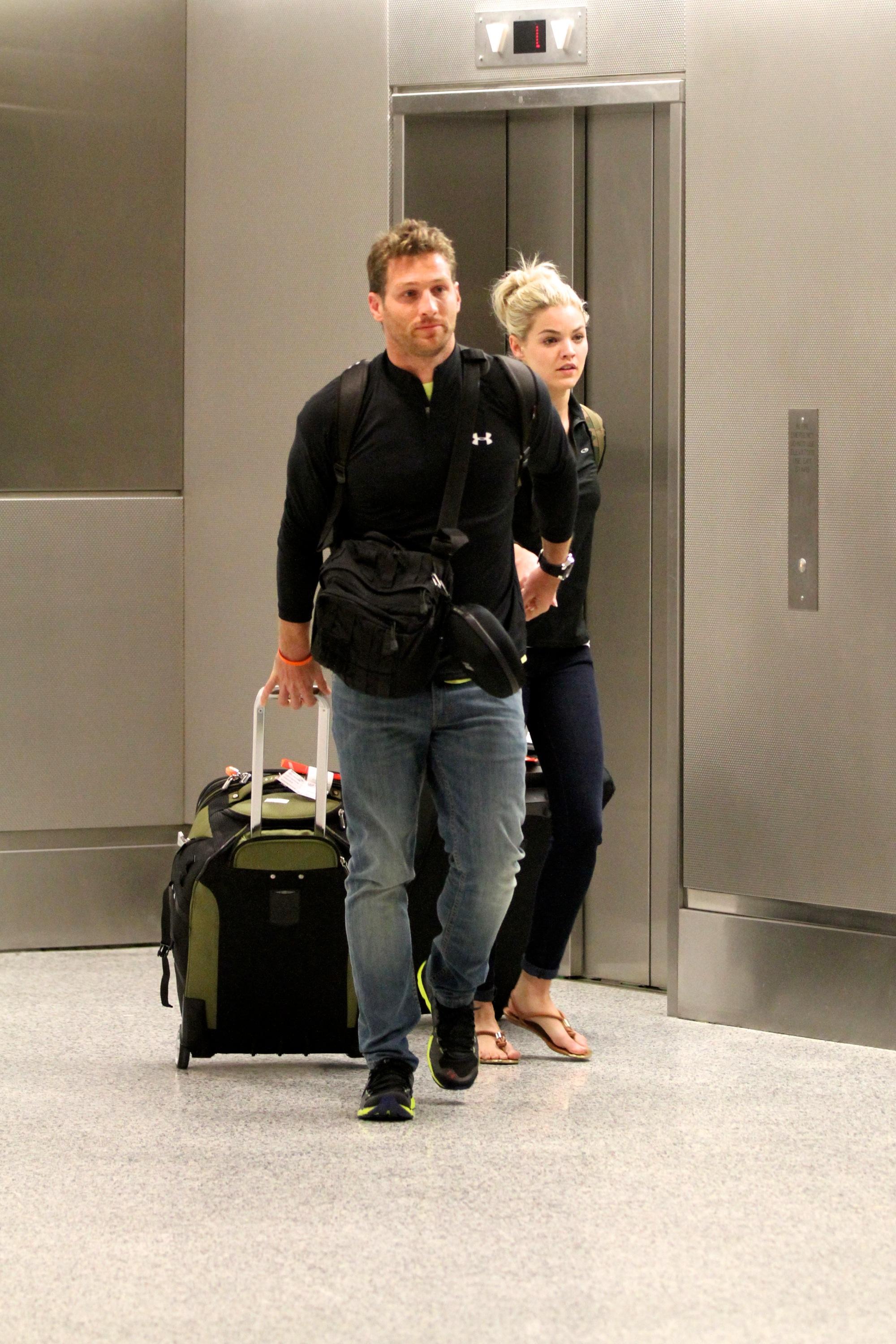 Juan Pablo Galavis and Nikki Ferrell arrive at Miami International Airport