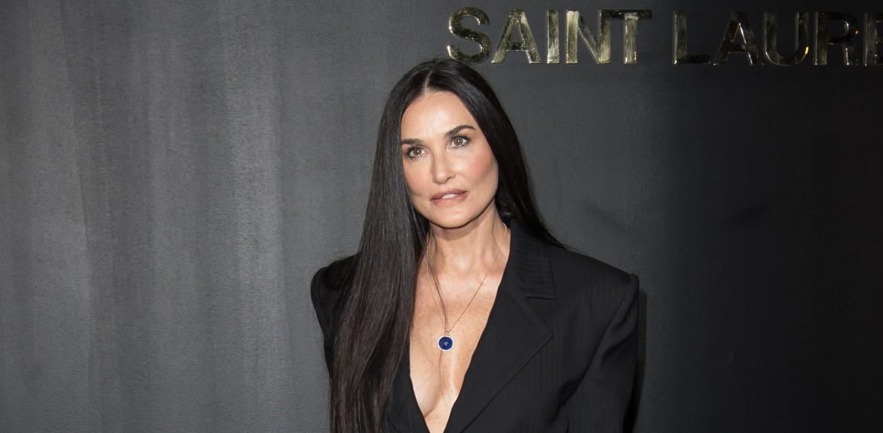 Demi Moore unveils swimsuit collection, posing poolside in her own designs