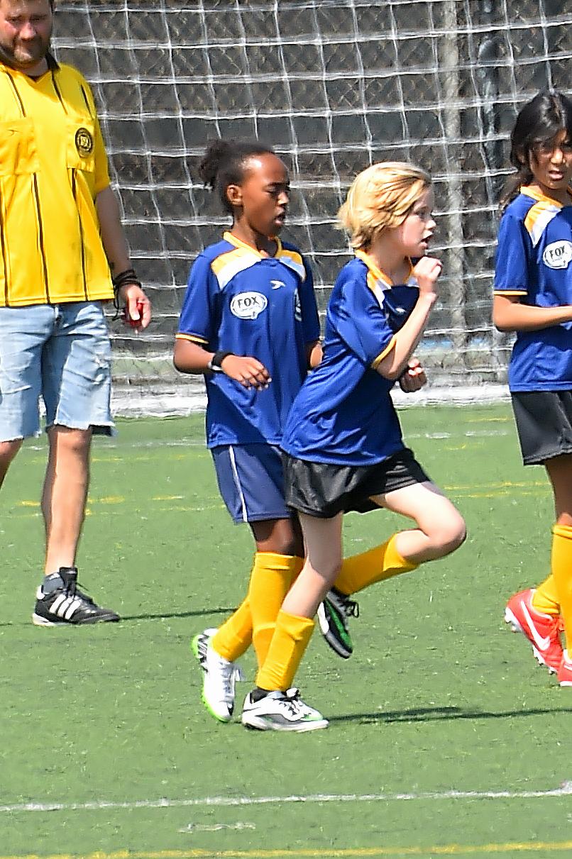 Shiloh and Zahara Jolie Pitt are accompanied by a bodygaurd to their Soccer Game in Studio City