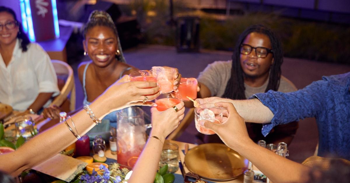 Image of strangers turned into friends at a long communal table in Downtown Los Angeles.