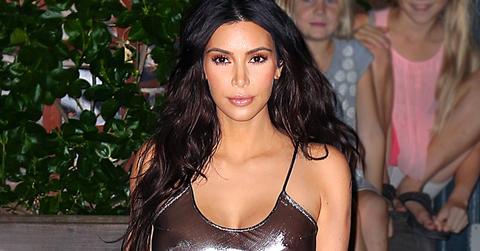 Kim Kardashian steps out in a revealing futuristic metallic outfit in NYC.