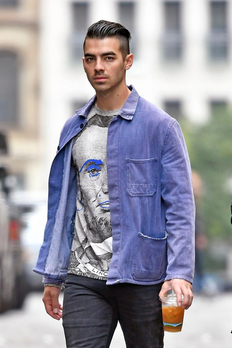 Joe Jonas wears an Abe Lincoln t shirt while going on a coffee run in Tribeca, New York City