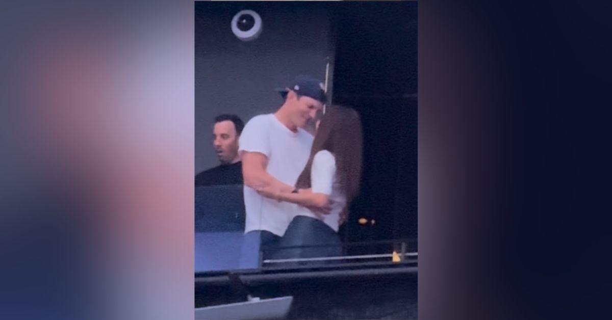 image of Ashton Kutcher and Mila Kunis danced at a Backstreet Boys concert.