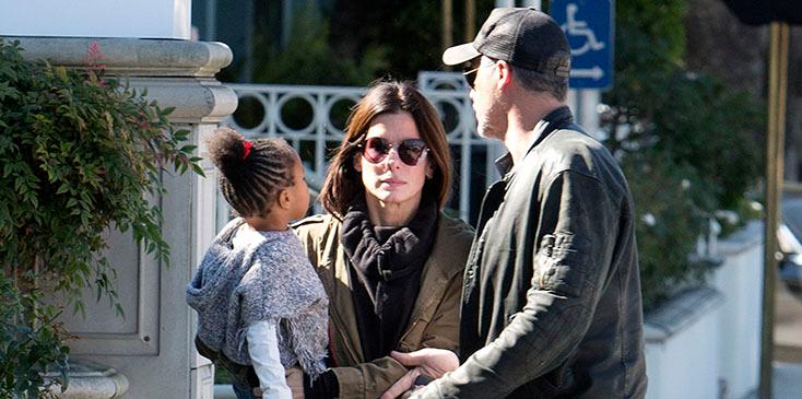 EXCLUSIVE: *** Premium Exclusive Rates Apply*** Sandra Bullock doesn&#8217;t look to impressed with boyfriend Bryan Randall as she holds her daughter Laila while they pick up coffee in Studio City, CA