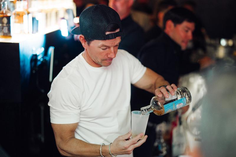 mark wahlberg pours flecha azul tequila at la neta grand opening