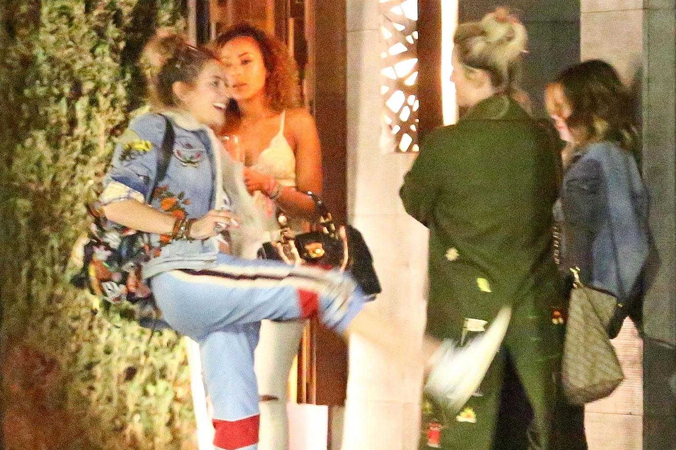 *EXCLUSIVE* Paris Jackson kicks her friend in the butt on the way out of Nobu in Malibu