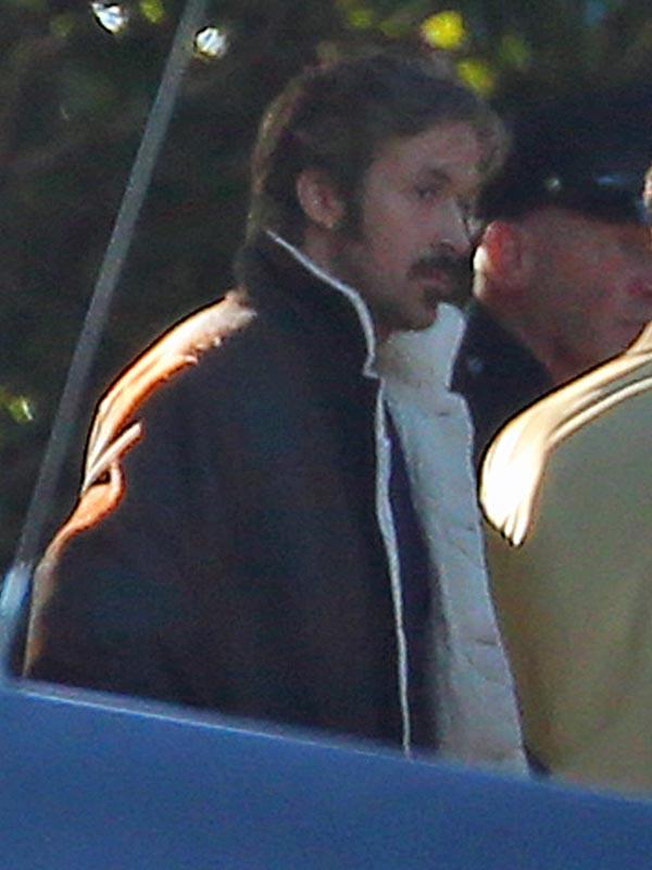 Ryan Gosling looks a little roughed up and really hot on the set