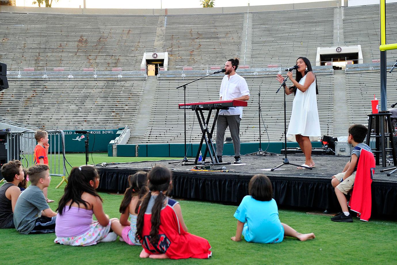 Us the Duo performs for families affected by childhood cancer at Campout on the Field, an event co hosted by Northwestern Mutual, the Rose Bowl Stadium and Rose Bowl Legacy Foundation.