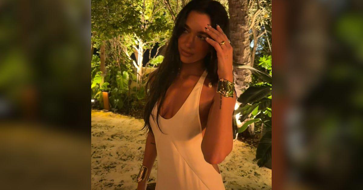 Image of Dua Lipa stunned in a busty white number in Florida.