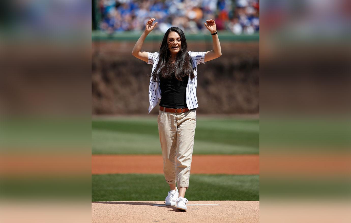 Mila Kunis sports fitted LA Dodgers jersey and skinny jeans to throw the  game's first pitch