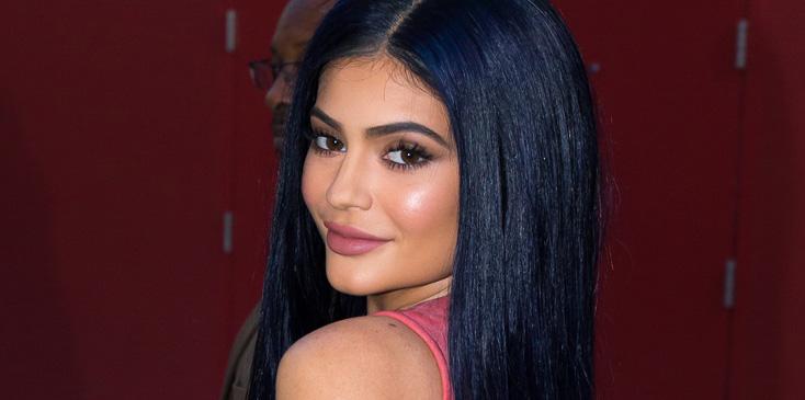 Kylie Jenner shows off dark blue hair at Sugar Factory Orlando grand opening.