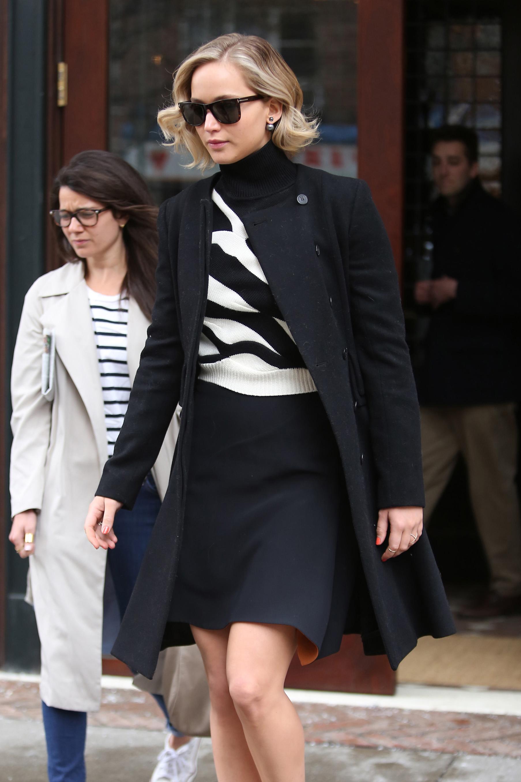 A stylish Jennifer Lawrence leaves the Greenwich Hotel with her entourage