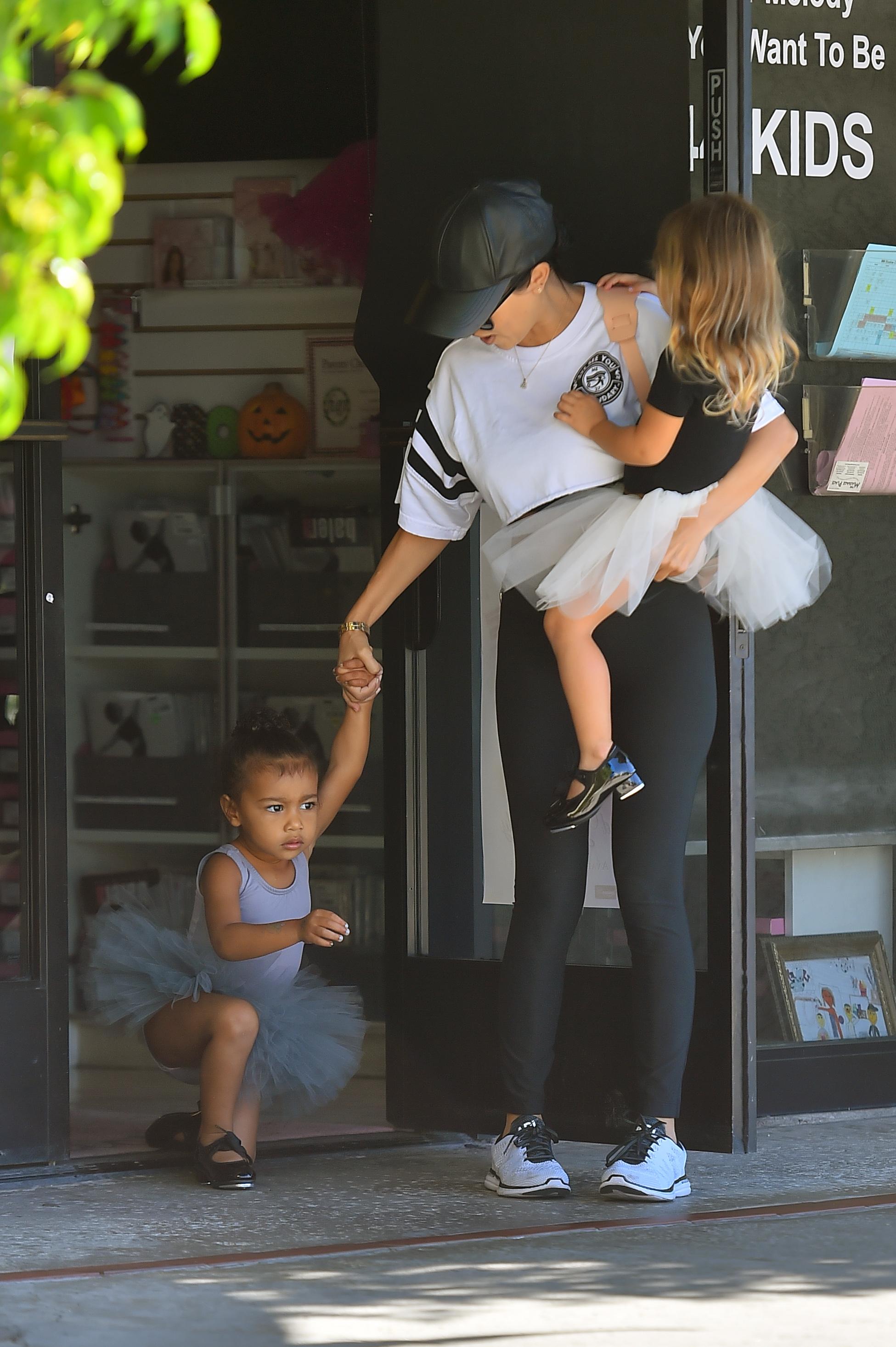 North West trips as she exits dance class with her aunt Kourtney Kardashian