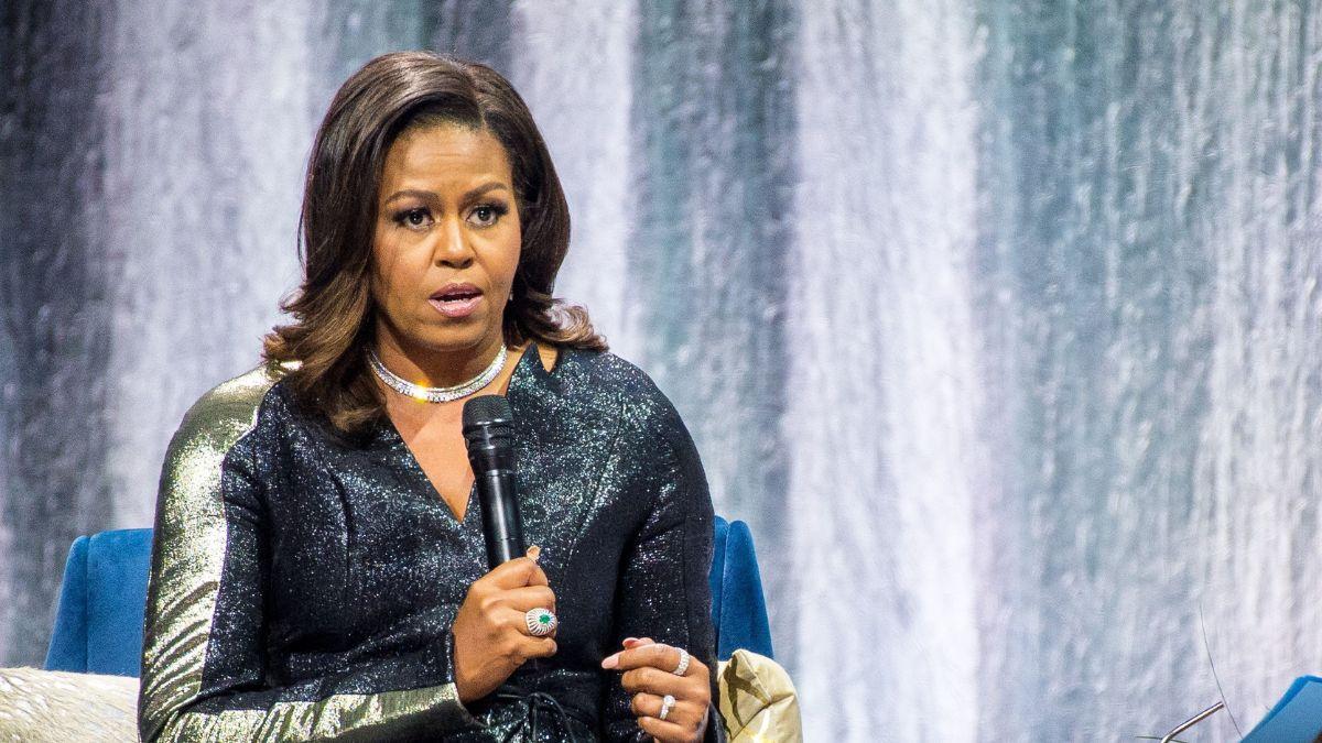 image of Michelle continued her speech by rounding off her list of Barack’s record.