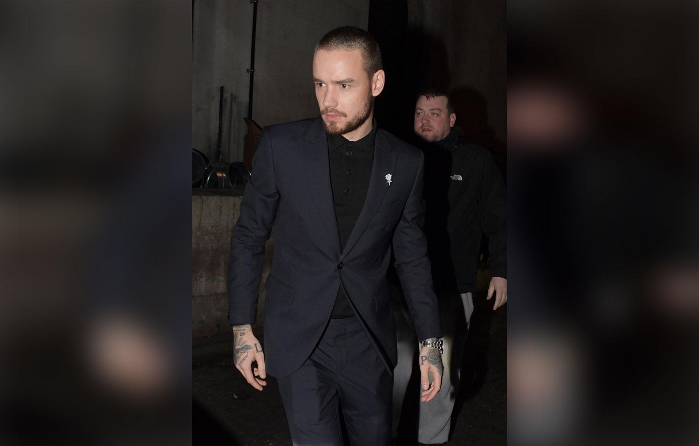 Liam Payne and Cheryl Cole look downbeat following Brit Awards