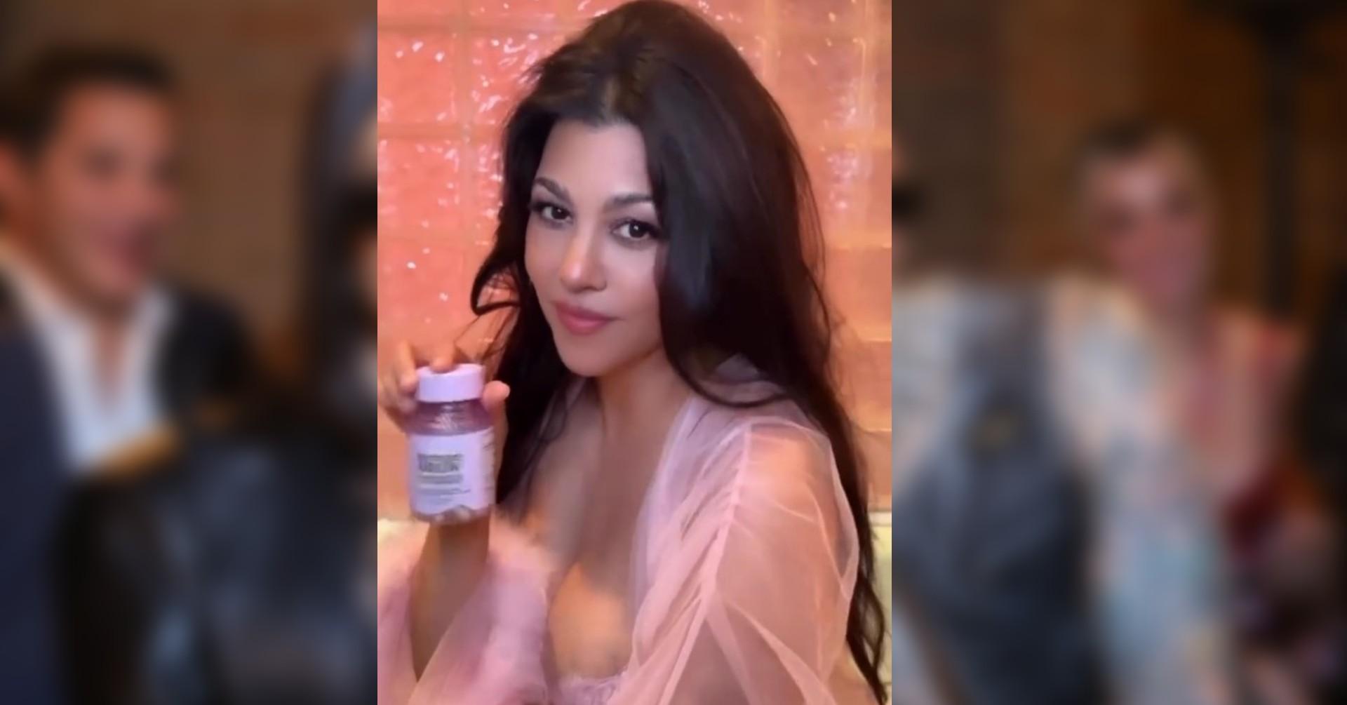 kourtney kardashian nearly spills out pink robe watch