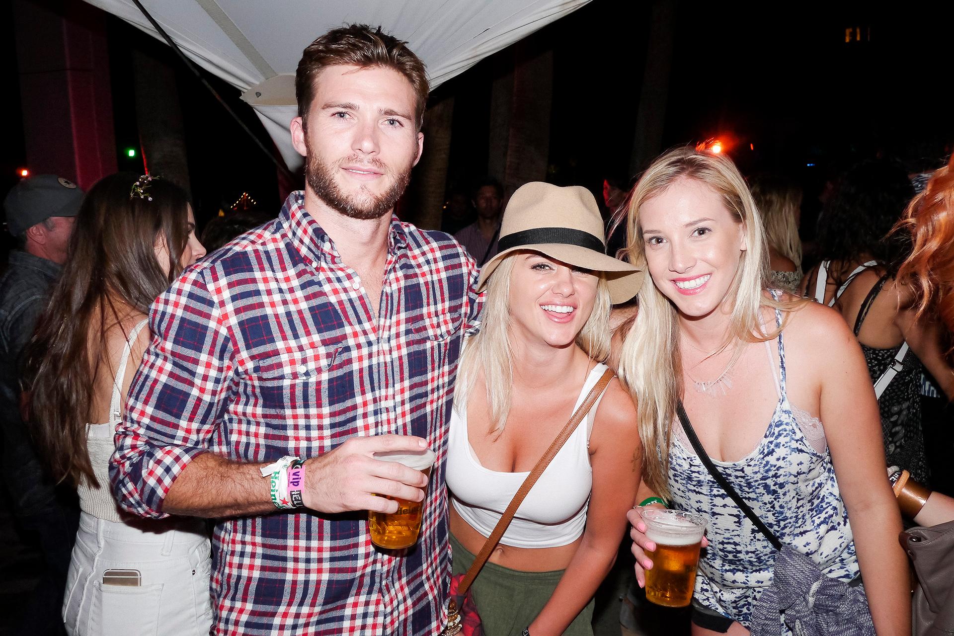 EXCLUSIVE: Scott Eastwood hangs out with some hot girls and sister Francesca Eastwood in the Heineken House during day 2 of the Coachella Music Festival in Indio, Ca