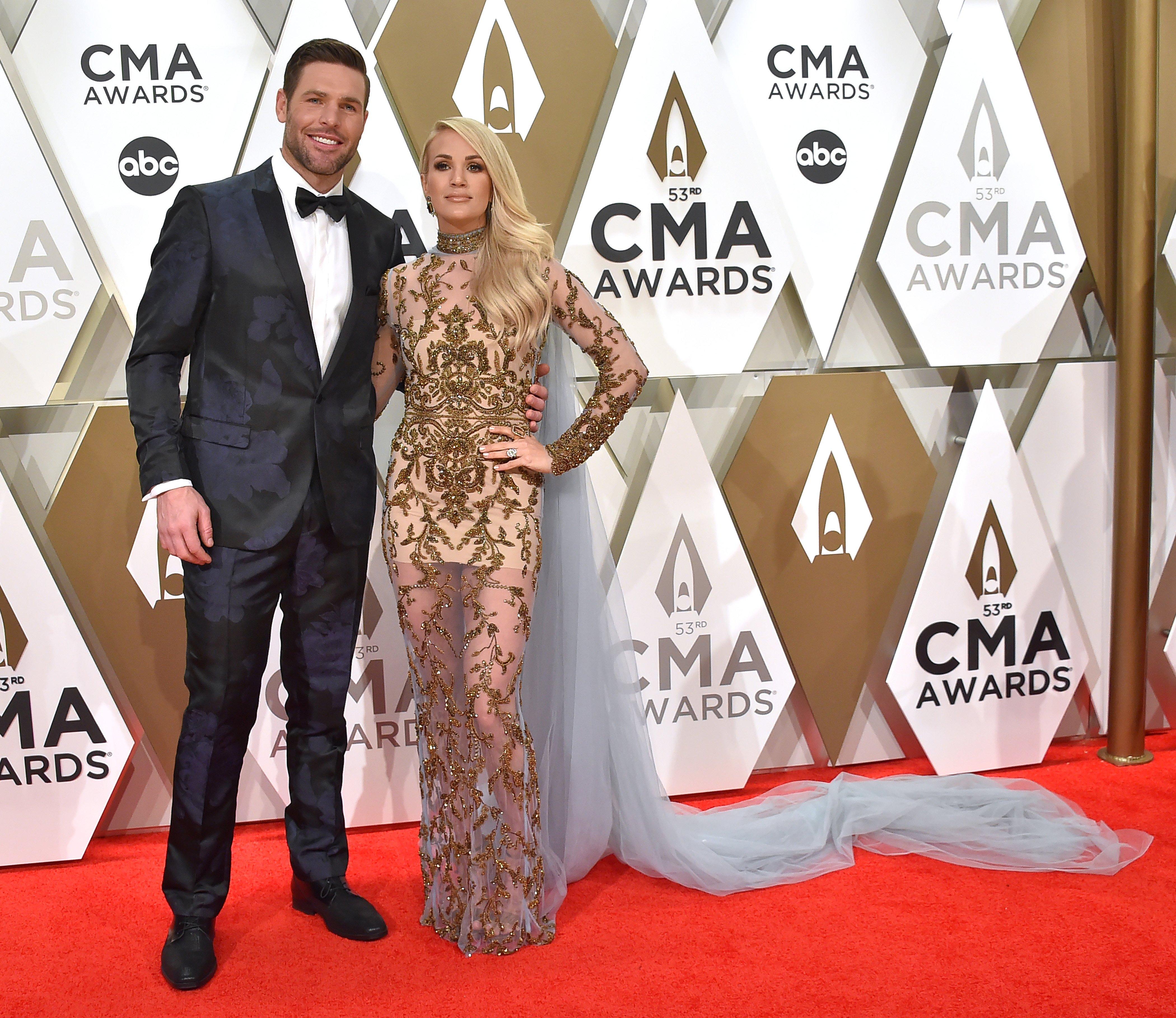 Carrie Underwood Walks Carpet with Husband Mike Fisher at CMA