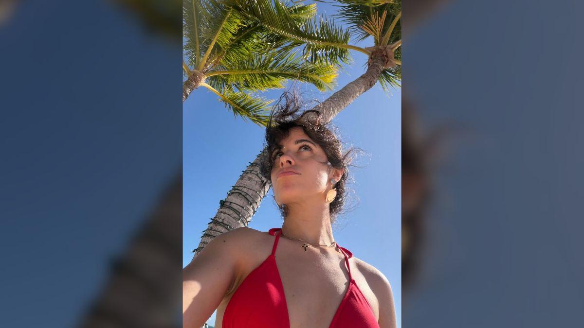 Image of Camila Cabello lounged by the beach.
