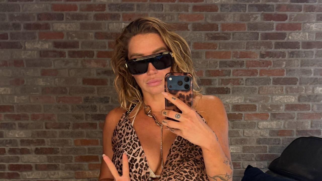 image of Kesha celebrated the final night of The Freedom Tour on August 30 with a cheetah-print mini dress, silver body chains and black sunglasses.