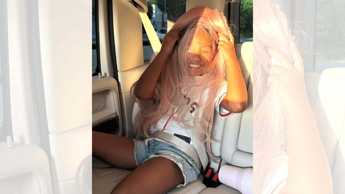 Image of Stormi Webster tried on the pink wig for a silly snap. 