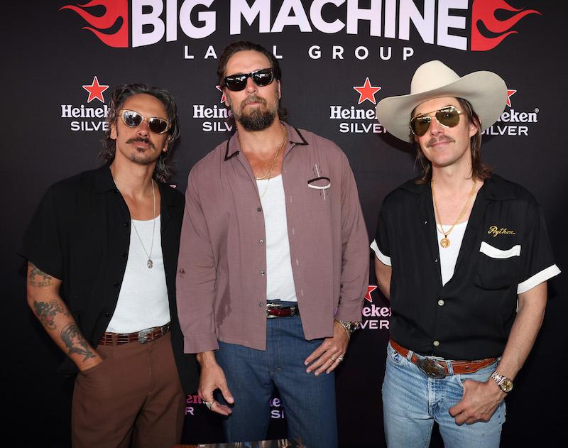 cameron duddy mark wystrach and jess carson of midland attend big machine label group x cma fest  at big machine pop up at bell bottoms up on june   in nashville tennessee photo by terry wyattgetty images for big machine l