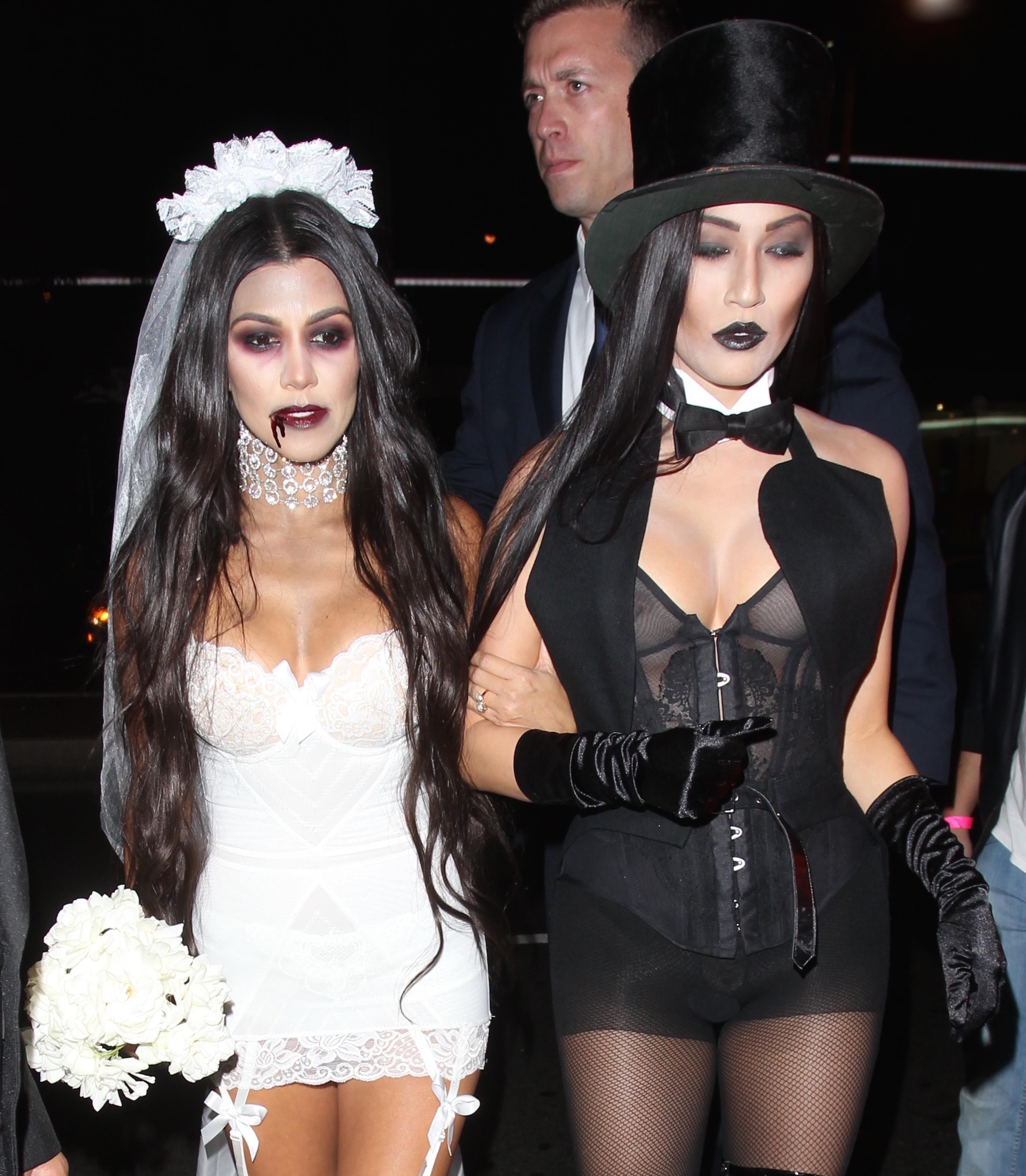 Kourtney Kardashian and a female friend are dressed as Bride and Groom as they enter a Los Angeles nightclub