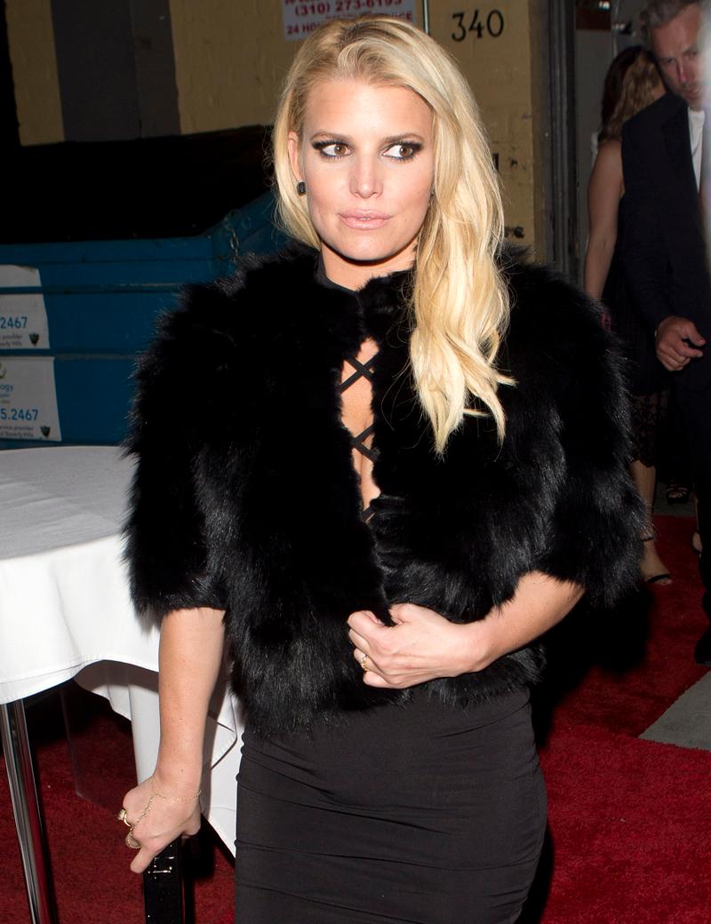 Jessica Simpson looking beautiful in a black dress and a Black fur coat along  with her husband Eric Johnson were seen leaving through a back alley way of an Art Gallery in Beverly Hills, CA