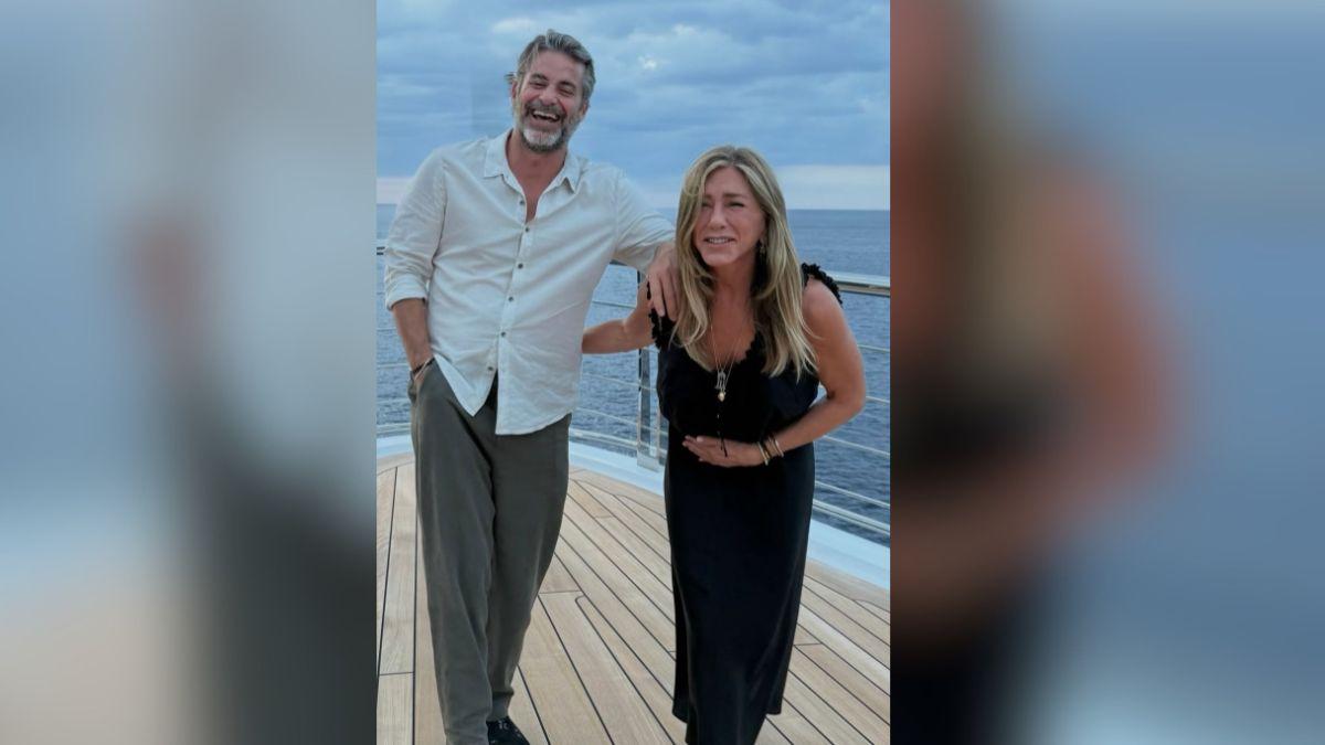 Image of Jennifer Aniston and Jim Curtis fueled engagement rumors.