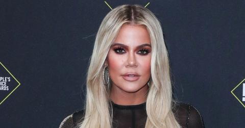 Khloe Kardashian Wearing a Black Dress On a Red Carpet