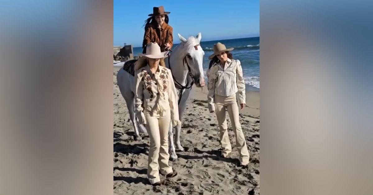 Image of Priscilla Presley posed on a magazine cover with her granddaughters.