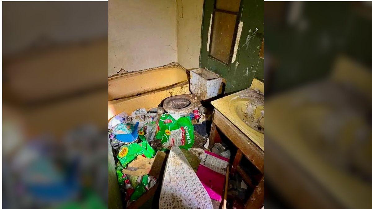 image of Bathrooms inside the home appeared coated in grime, with garbage covering much of the floor.