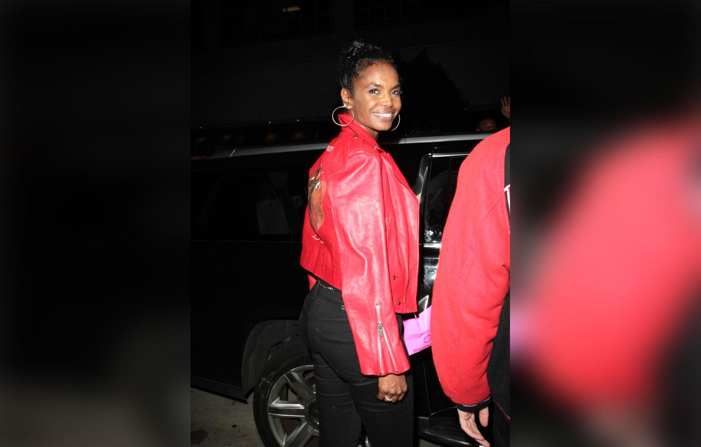 Kim Porter red jacket