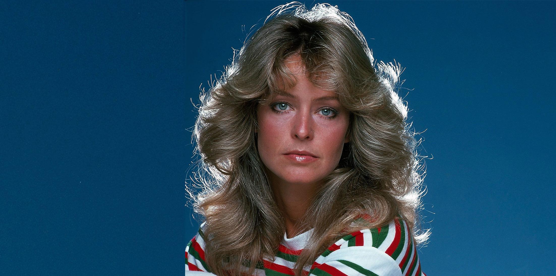 Farrah Fawcett wears a green and red stripped white shirt.