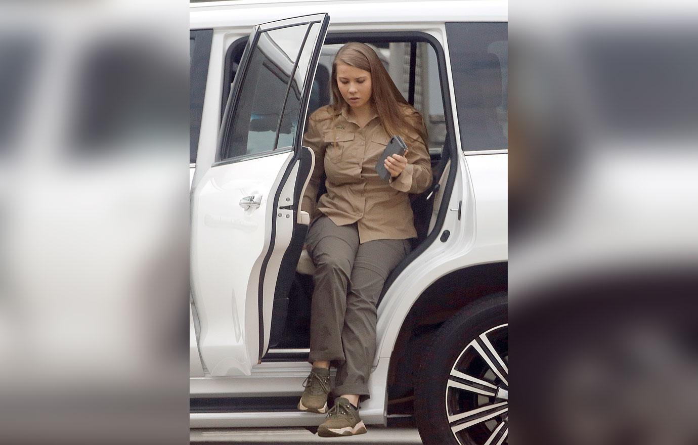 Pregnant Bindi Irwin and Chandler Powell at airport on the anniversary of Steve Irwin's death